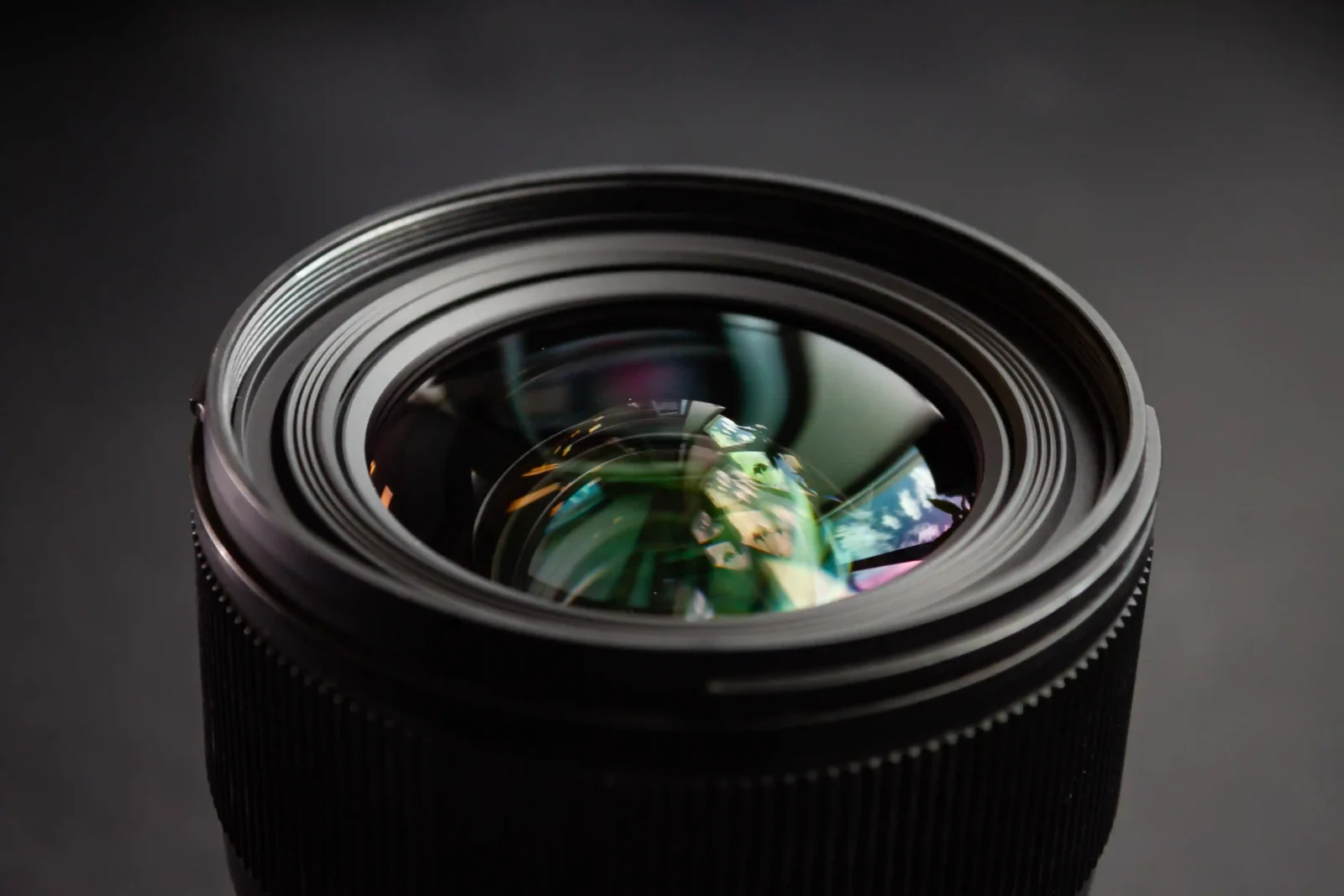 Close-up of a camera lens, where aperture controls depth of field